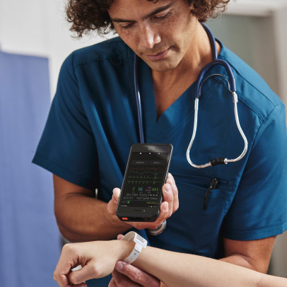 A doctor scans a patient's ID tag