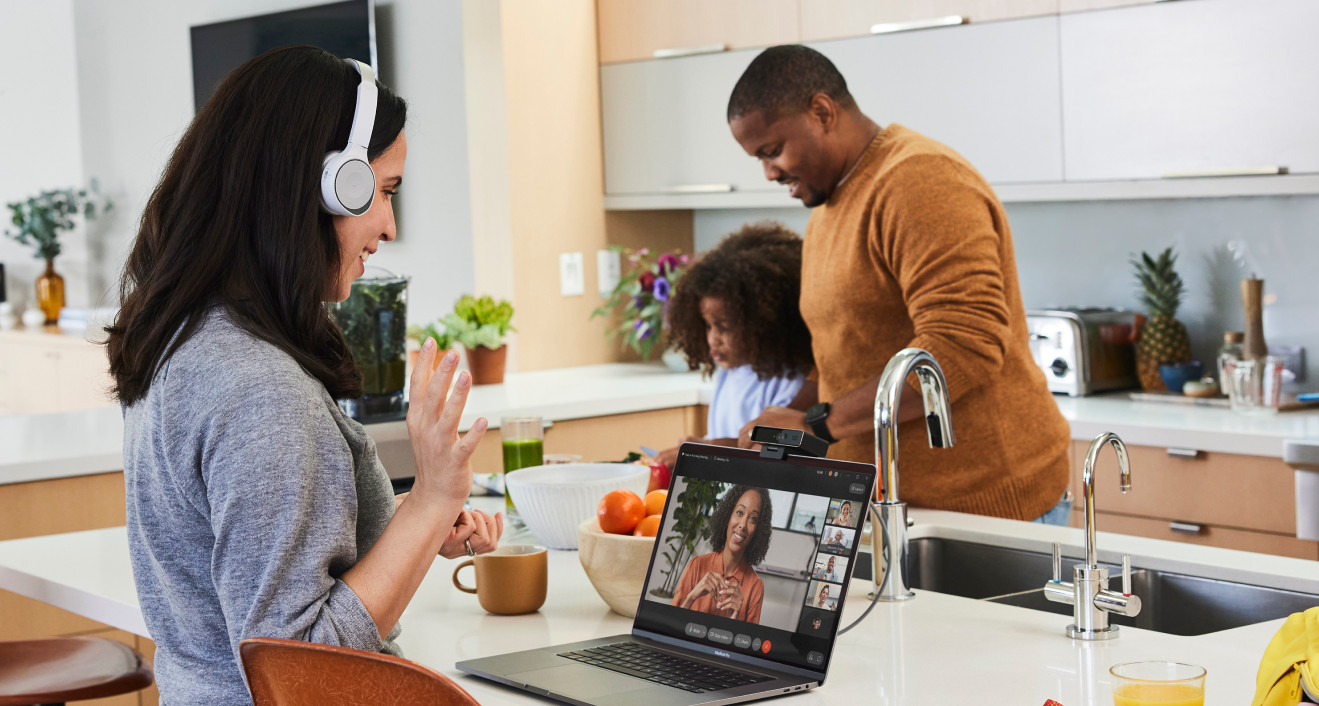 Person takes a Webex Meeting in the kitchen