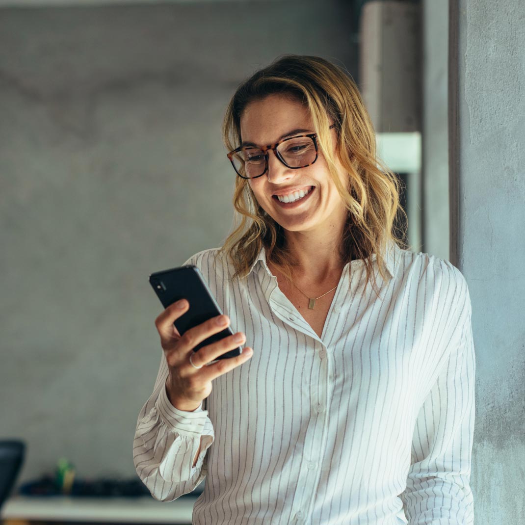 person using mobile device, looking pleased